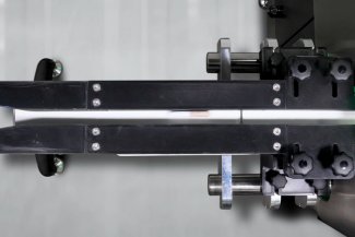 Overhead shot of pre roll going in EMFR machine for check weighing